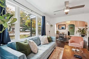 Living room with sleeper sofa, two armchairs & smart TV