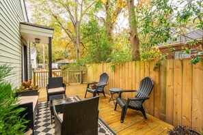 Peaceful side deck with outdoor seating - goes perfect w/a morning cup of coffee
