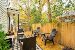 Peaceful side deck with outdoor seating - goes perfect w/a morning cup of coffee