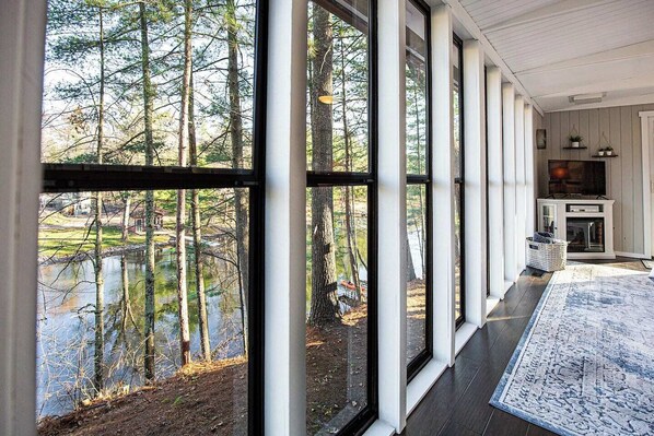 Living room, electric fireplace and the view of Clam River