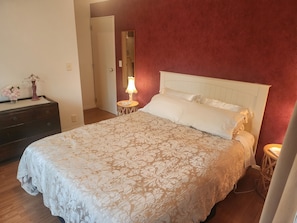 Master Bedroom with door to the bathroom in the background.  