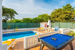 Enjoy a game of pool next to the pool