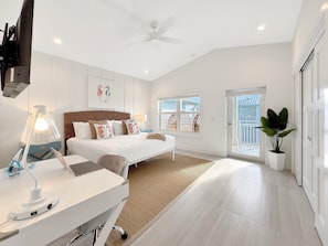 Primary Bedroom | Located on third floor, offers a king sized bed, ensuite bathroom, desk, Balcony, and  TV.