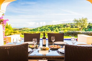 Dine al fresco with a pool view