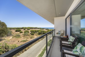 Balcony view of countryside and beach area