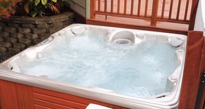 relax in this waterfall jet hot tub