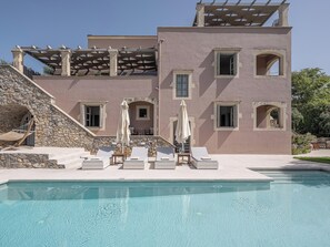 The 320 sqm villa spans three elegant levels, providing spacious and comfortable accommodations