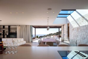 Built-in sound systems elevate the entertainment experience throughout the space