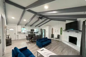Relax after a beach day in this bright, spacious living room for family time.