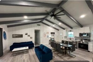 The open layout flows into a bright living room and easy dining access.