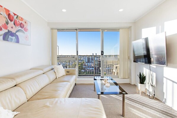 Relax on the couch and watch TV on your large widescreen TV.