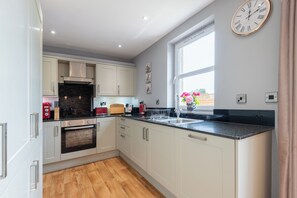 Open plan kitchen leading onto the dining area.