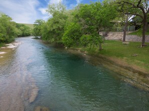 Ariel picture of the serene, peaceful river. The property is to the right. 