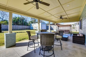 Covered Patio | Dining Area | Seating | Swing | Charcoal Grill