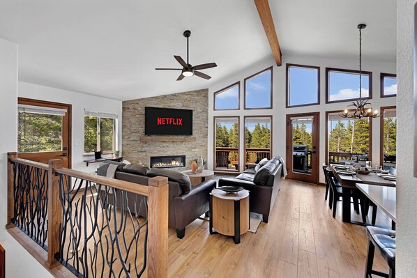 Kick back in our cozy living room with a warm fire and mountain views