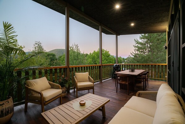 The stunning balcony. An extension of the living area with lounge suite, dinning table and BBQ