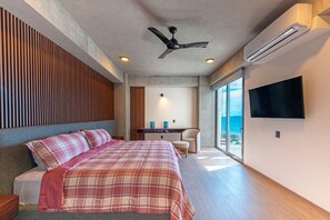 Ocean-view master bedroom with king-size bed
