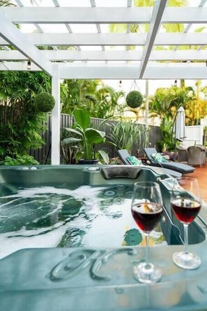 The hot tub is a wonderful addition to the outdoor amenities, providing a perfect spot for a relaxing, spa-like experience.
