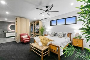 The king bedroom is a spacious, luxurious retreat that features a grand king-sized bed, fitted with a plush mattress and high-quality linens for a restful night’s sleep.  The bedroom also features a spacious ensuite bathroom with elegant fixtures.