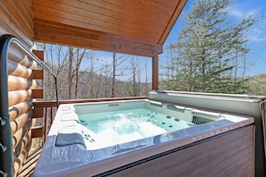 Soak your worries and stress away in the hot tub located right off the living space on the main level.