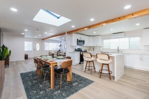 This bright dining area blends style and function in an open-concept layout.