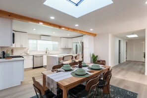This bright dining area blends style and function in an open-concept layout.