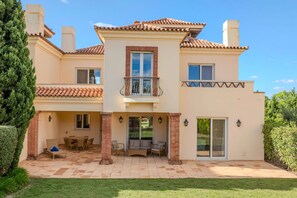 Villa and shaded terrace which leads to pool