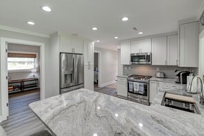 Modern kitchen that is fully stocked! 