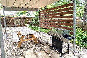 Covered patio with BBQ and seating