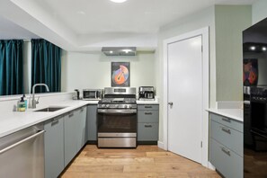 Fully stocked kitchen with coffee and espresso maker and electric kettle