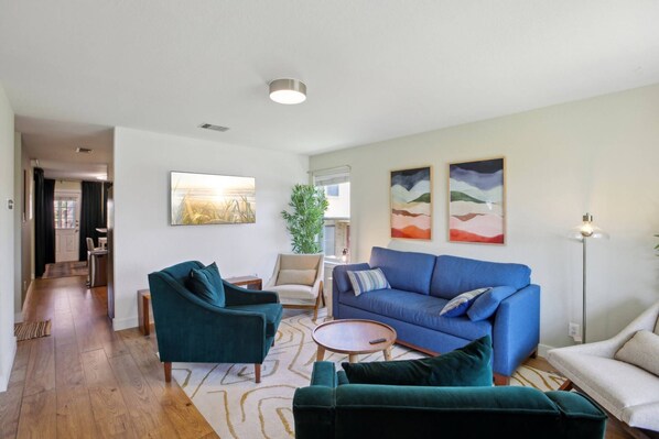 Comfy living room with smart TV and Queen size sleeper sofa