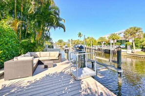 Dockside bliss—private boat slip with cozy outdoor seating. 