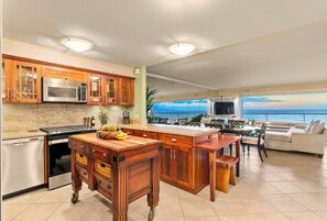 Featuring modern appliances and a prep island.