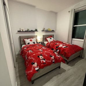Whimsical twin beds in a Disney-inspired space kids will love.