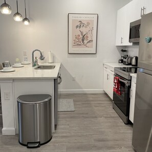 Fully equipped modern kitchen located downstairs