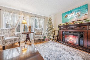 Living Room with large smart tv and electric fireplace