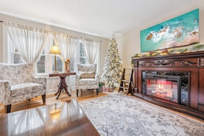 Living Room with large smart tv and electric fireplace