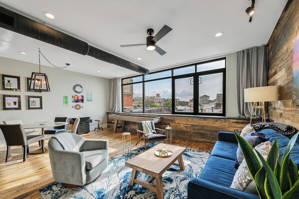 Large living space with TV, shuffleboard and picture window