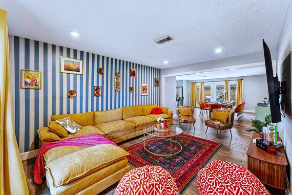 F.R.I.E.N.D.S.-themed living room with plush couch
