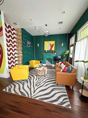 Funky fun professionally designed living area with convertible sofa