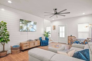 A warm and inviting living space, complete with modern touches and plenty of room for everyone to unwind.