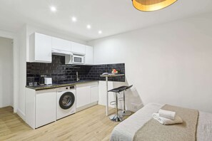 The kitchen is fully equipped to prepare a simple meal 