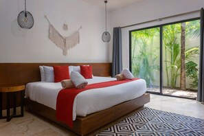 Spacious and modern room with a comfortable king-size bed. It has a small private patio.