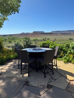 Table for 6 with fire feature to sit and soak up the beautiful views!