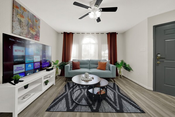 Relax & unwind! A chic living room with streaming services & cozy seating📺🛋️