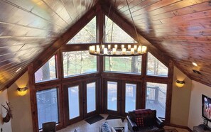 Breathtaking views, warm wood accents, and the perfect cabin glow!