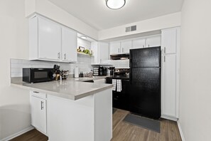 A chef’s dream! This kitchen offers ample counter space, modern appliances, and all the essentials for a seamless cooking experience.