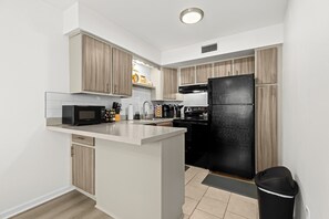 This modern kitchen is both functional and stylish, complete with high-end appliances to make every meal a breeze."