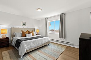This luxurious king bedroom offers a cozy sanctuary with plenty of space to unwind and recharge.