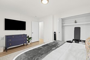 Enjoy a serene escape in this beautiful king bedroom, offering plenty of space for relaxation and a peaceful night’s sleep.